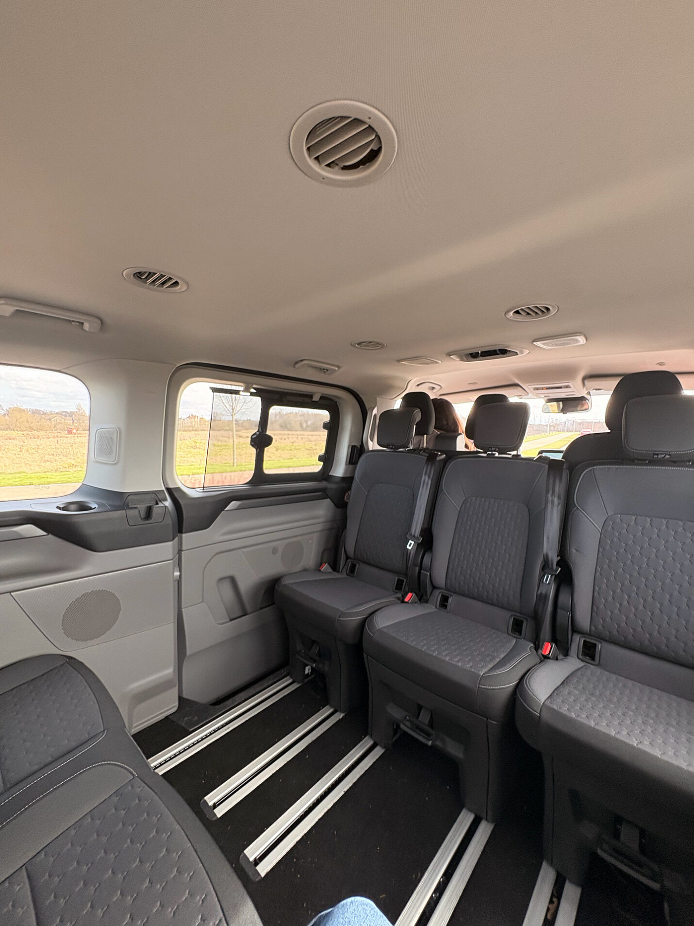 The clean and spacious interior passenger cabin of the Zoom Airport Parking courtesy minibus used for Glasgow Airport transfers.