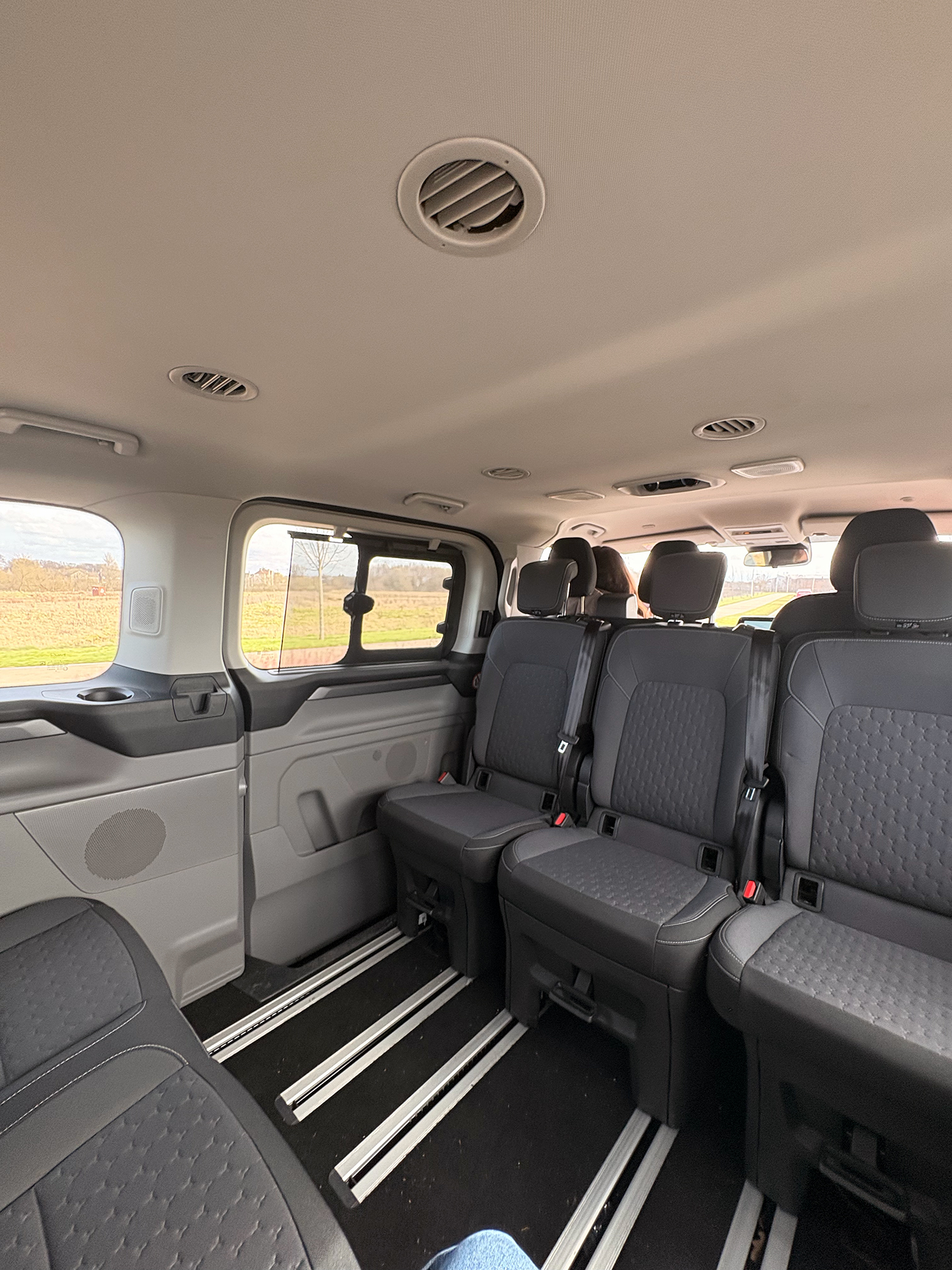 The clean and spacious interior passenger cabin of the Zoom Airport Parking courtesy minibus used for Glasgow Airport transfers.